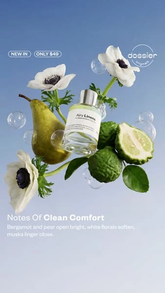 Dossier Airy Linens ad with a floating perfume bottle, pear, bergamot and white flowers